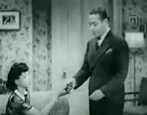 Nita gives Jim the gun she found in her dressing room